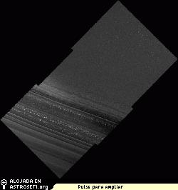 MRO HiRISE image of the north polar layered deposits, taken during the summer when carbon dioxide frost had evaporated from the surface. Layers at the bottom of the image are visible due to differences in slope between them. The slope variations are probably caused by differences in the physical properties of the layers. Thinner layers may represent annual deposition of water ice and dust.
