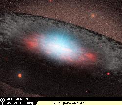 Esta concepcin artstica muestra un agujero negro sper masivo en el centro de una galaxia. El color azul representa la radiacin emitida por el material muy prximo al agujero negro. La estructura griscea que rodea al agujero negro, denominada torus, est compuesta de gas y polvo.
Crdito: NASA/JPL-Caltech