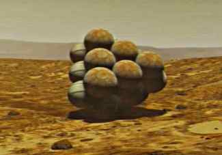 Una imagen de baja resolucin que muestra al Mars rover protegido por una pirmide amortiguadora de airbags. El polvo haba cubierto las bolsas del rover, convirtindolas en bolsas momentneas para las imgenes de baja resolucin que llegaban desde la plataforma de aterrizaje de la Spirit. Crditos: D.Maas/NASA/JPL/Cornell