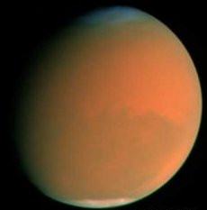 Una bola de billar naranja: Una tormenta de polvo a nivel mundial en Marte en el 2001 opac los normalmente ntidos detalles. <a href=http://ciencia.nasa.gov/headlines/y2001/ast11oct_2.htm target=_blank>[ms informacin en espaol]</a>
