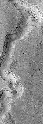 El Nanedi Valles de 200 metros de ancho es uno de varios lugares en Marte que muestra evidencia de que alguna vez fluy el agua en el planeta. Aunque las imgenes recientes del Orbitador Mars Global Surveyor indican que Marte nunca tuvo un gran ocano o mar, como esperaban encontrar los cientficos. An as, la presencia de agua fluyendo aumenta considerablemente las oportunidades de que la vida haya llegado a establecerse y a obtener un punto de apoyo. Crdito: NASA y Jet Propulsion Laboratory.